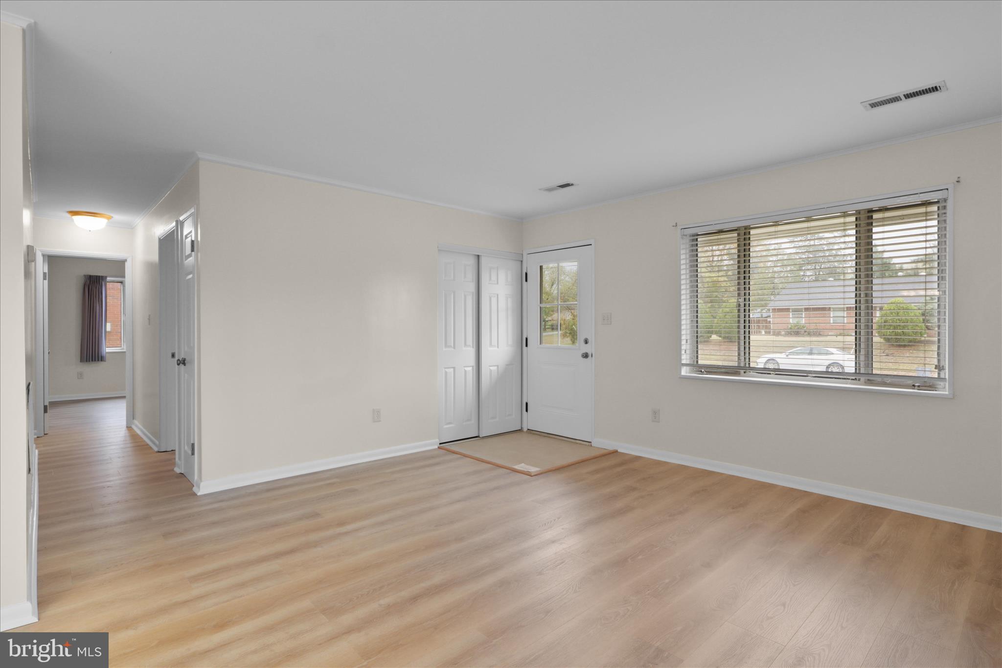 4017 Arcadia Road Alexandria, VA 22312 - Photo 5 of 25 a view of an empty room with wooden floor and a window