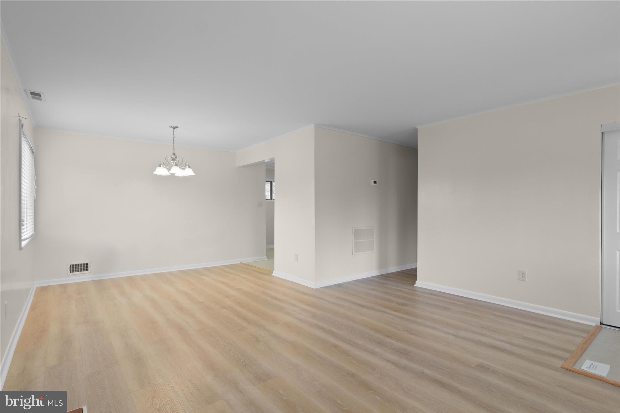 4017 Arcadia Road Alexandria, VA 22312 - Photo 6 of 25 a view of an empty room with wooden floor