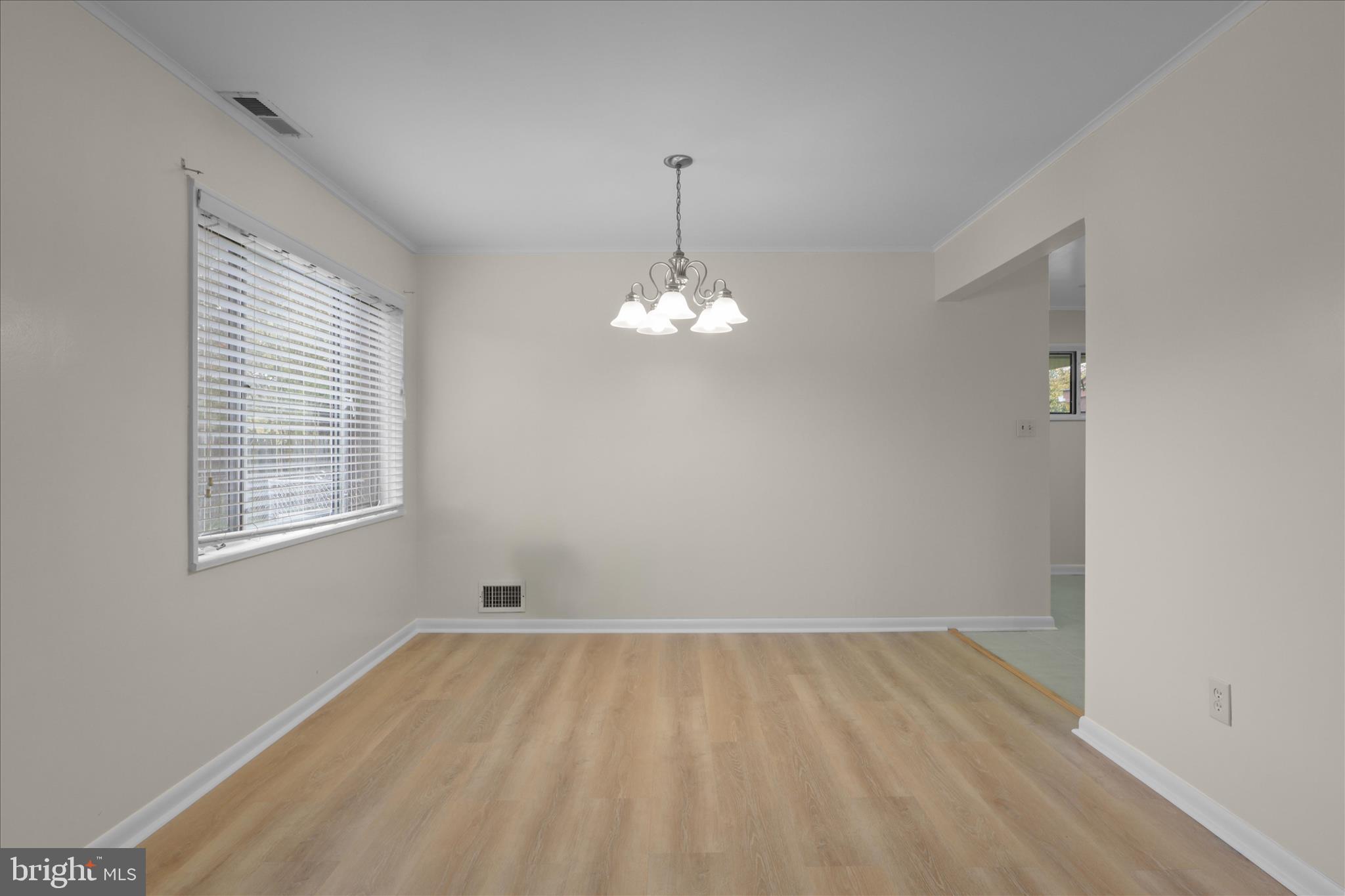 4017 Arcadia Road Alexandria, VA 22312 - Photo 7 of 25 wooden floor in an empty room with a window