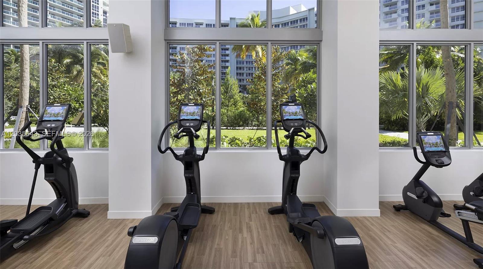 1500 Bay Road, Unit 450S Miami Beach, FL 33139 - Photo 14 of 22 a view of gym equipment with wooden floor windows