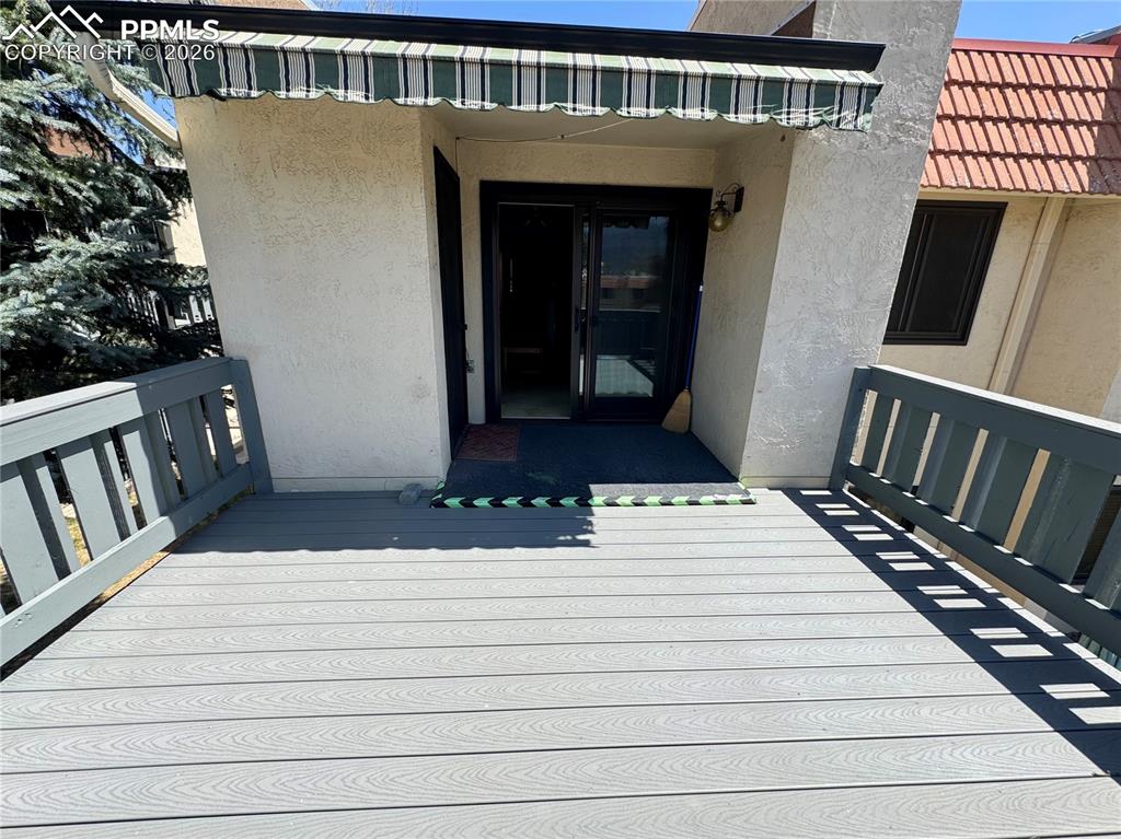 1034 Fontmore Road, Unit D Colorado Springs, CO 80904 - Photo 19 of 23 a view of balcony and wooden floor