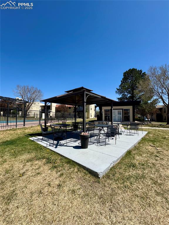 1034 Fontmore Road, Unit D Colorado Springs, CO 80904 - Photo 20 of 23 a view of swimming pool with outdoor seating and plants