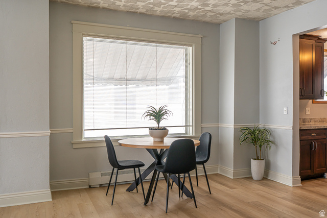 33 North 200 East Logan, UT 84321 - Photo 11 of 54 Dining area with light wood-style floors and baseboards