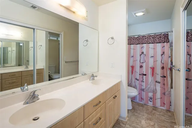 a bathroom with a double vanity sink mirror double and shower