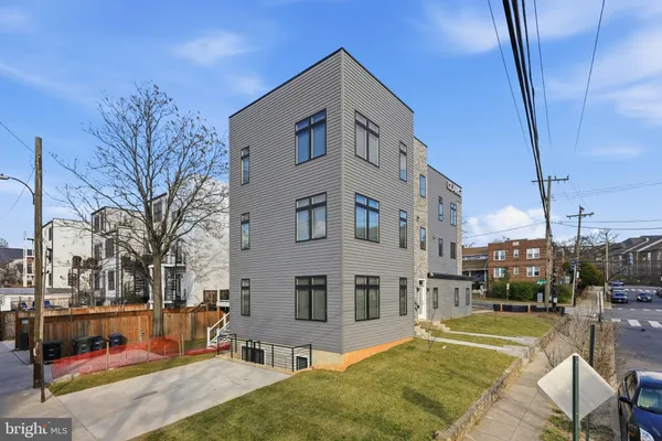 a view of a building with a backyard