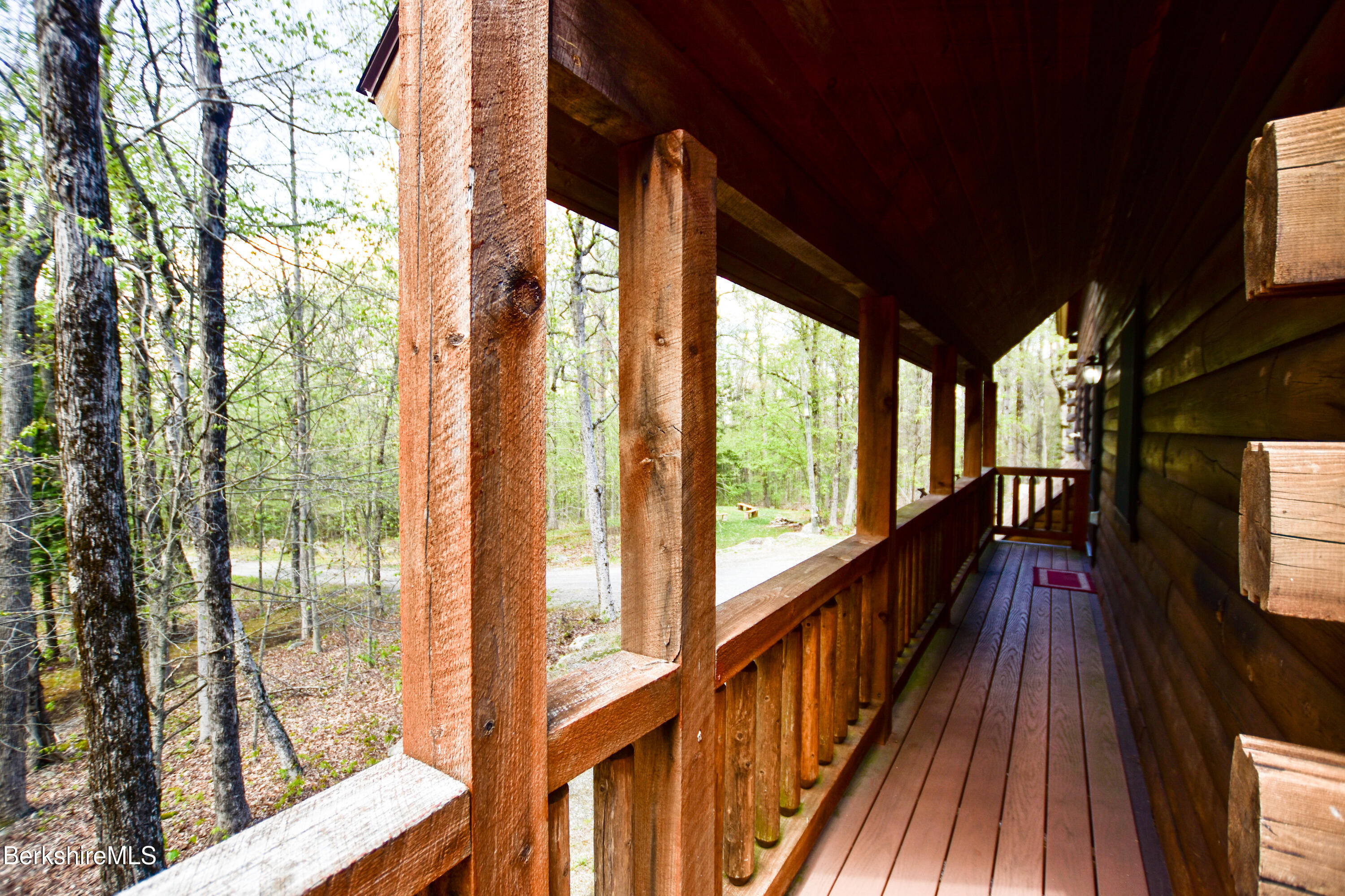 233 Algerie Road Becket, MA 01223 - Photo 46 of 48 a view of balcony with wooden floor and iron stairs