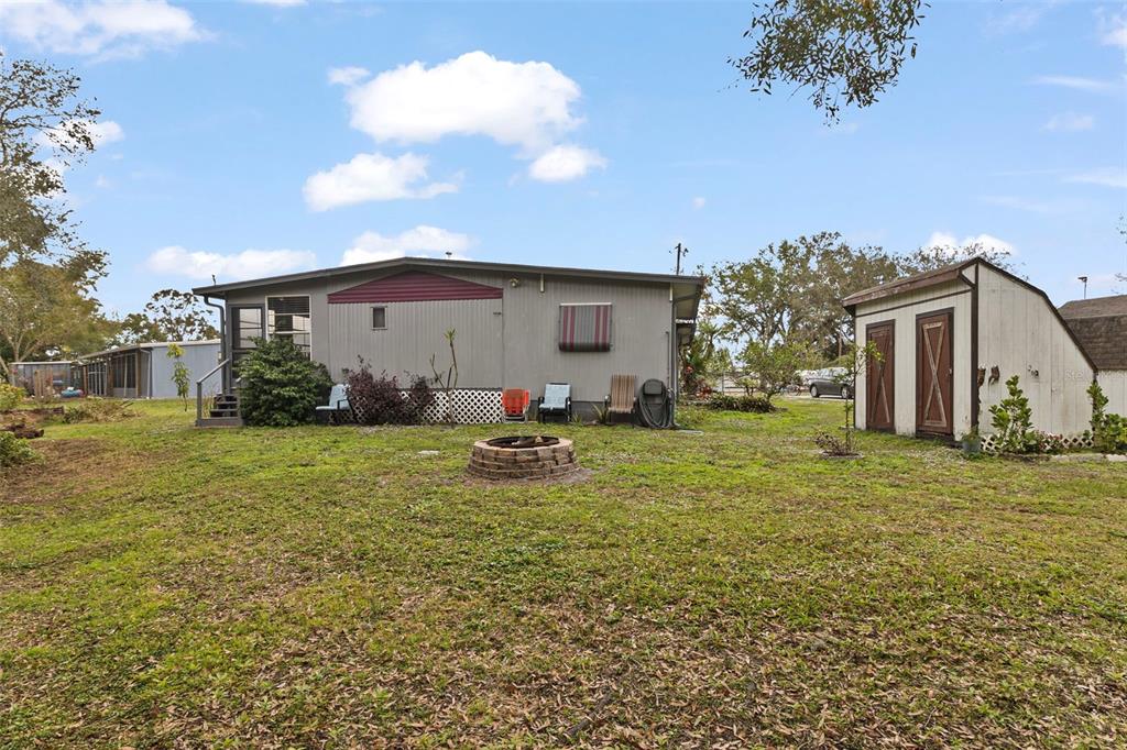 1381 Southeast Lake Road Arcadia, FL 34266 - Photo 19 of 21 a view of a backyard with plants and a patio