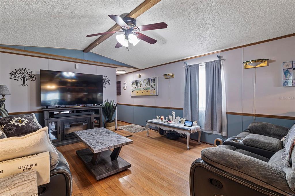 1381 Southeast Lake Road Arcadia, FL 34266 - Photo 5 of 21 a living room with furniture and a flat screen tv