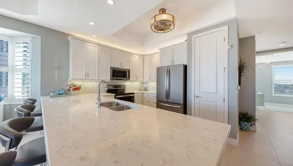 a kitchen with a dining table and chairs