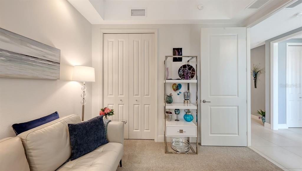 10530 Boardwalk Loop, Unit 505 Lakewood Ranch, FL 34202 - Photo 36 of 67 a living room with furniture and wooden floor