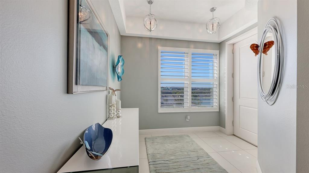 10530 Boardwalk Loop, Unit 505 Lakewood Ranch, FL 34202 - Photo 7 of 67 a view of an entryway with wooden floor
