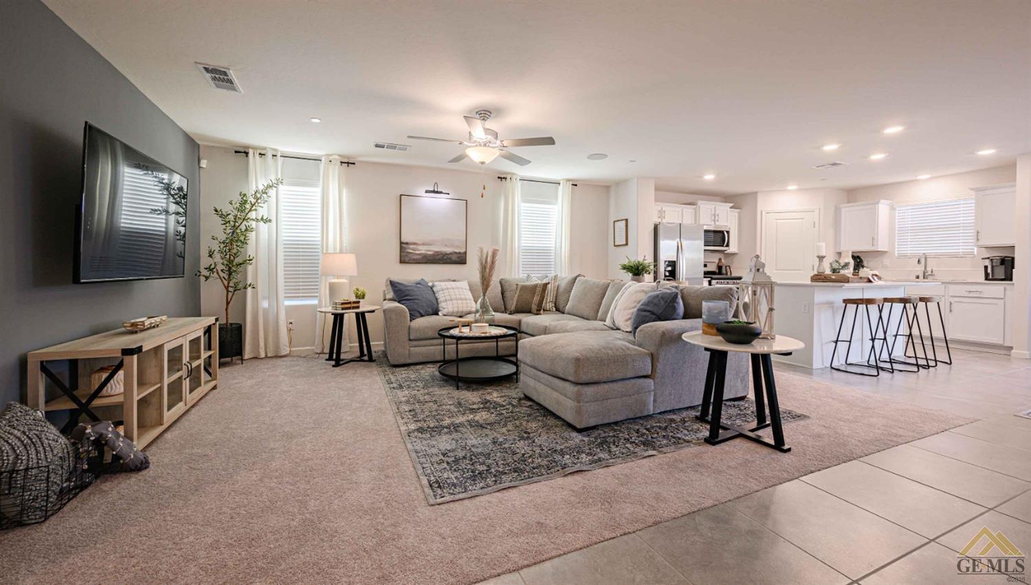 Undisclosed Address Bakersfield, CA 93313 - Photo 3 of 11 a living room with furniture and a flat screen tv