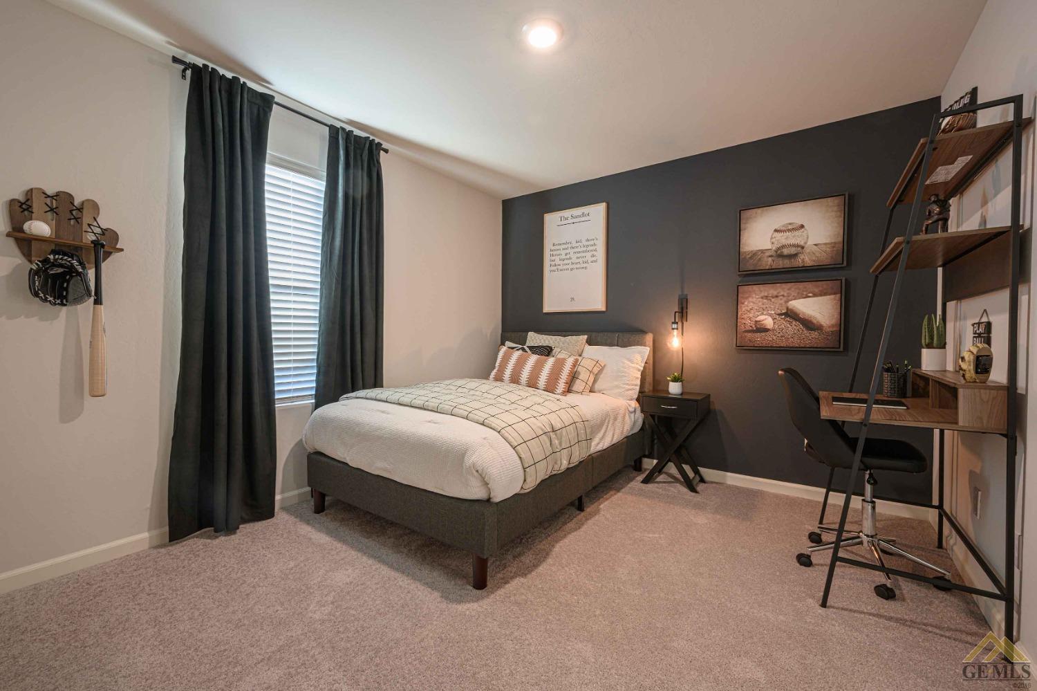 Undisclosed Address Bakersfield, CA 93313 - Photo 6 of 11 a bedroom with a bed a computer on the desk and a window