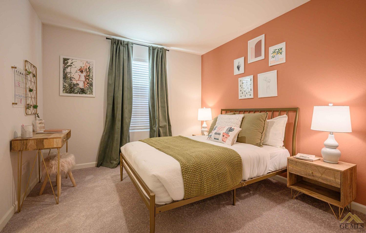 Undisclosed Address Bakersfield, CA 93313 - Photo 7 of 11 a bedroom with a bed and wooden floor