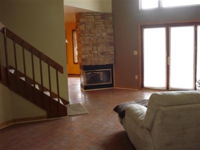 9344 Van Buren Street Crown Point, IN 46307 - Photo 4 of 10 a living room with furniture and a fireplace