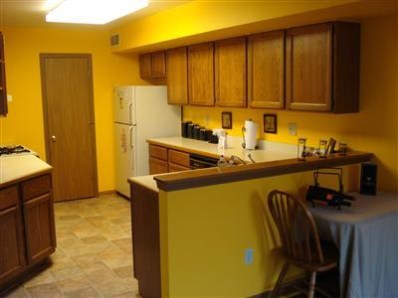 9344 Van Buren Street Crown Point, IN 46307 - Photo 7 of 10 a kitchen with a sink a stove and refrigerator