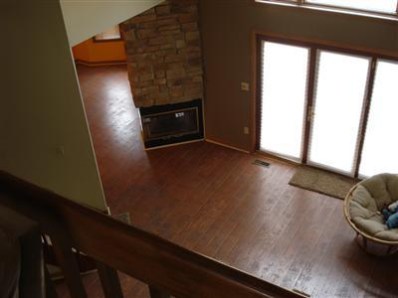 9344 Van Buren Street Crown Point, IN 46307 - Photo 10 of 10 a view of empty room with wooden floor and fan