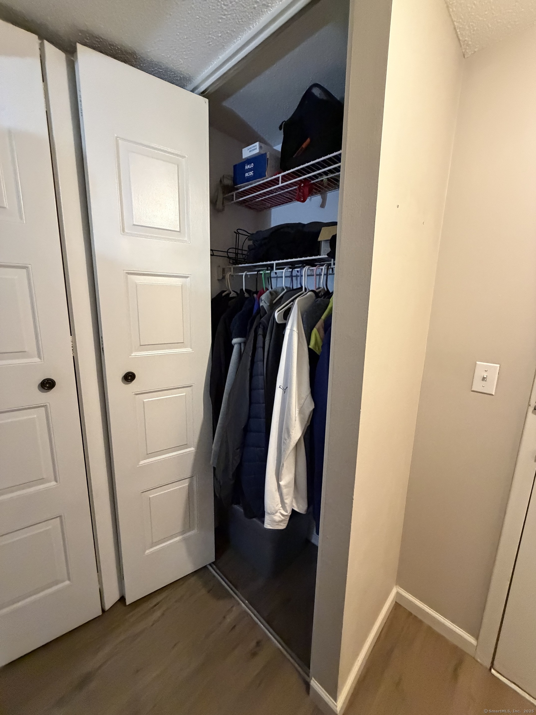 280 Burgundy Hill Lane, Unit 280 Middletown, CT 06457 - Photo 6 of 9 a view of walk in closet with clothes and shoes
