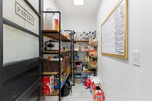 a view of storage and utility room with washer and dryer