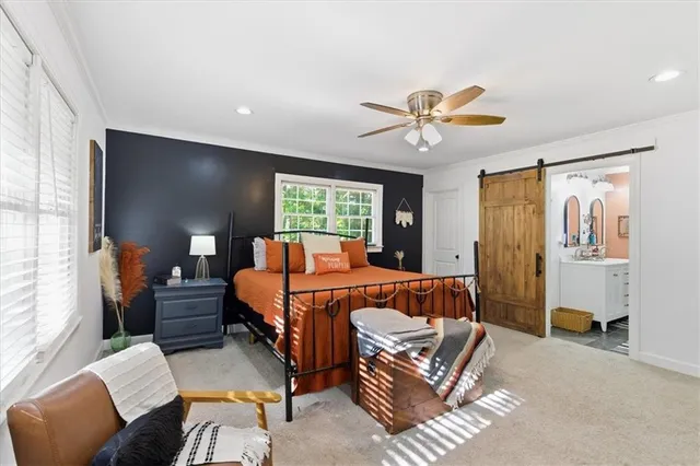 a bed room with a bed and a couch