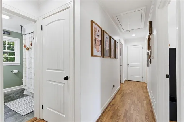 a spacious bathroom with a shower and a glass door