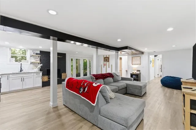 a kitchen with white cabinets stainless steel appliances and sink