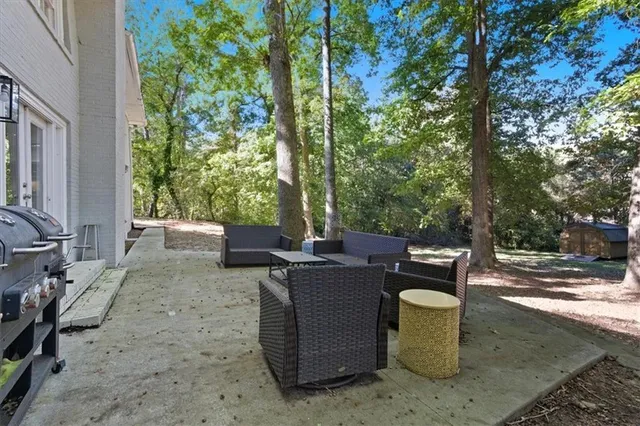 a view of a tree in the middle of a yard