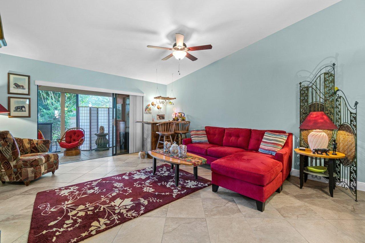 10948 Hidden Lake Place Boca Raton, FL 33498 - Photo 11 of 38 Living Area opens up to porch