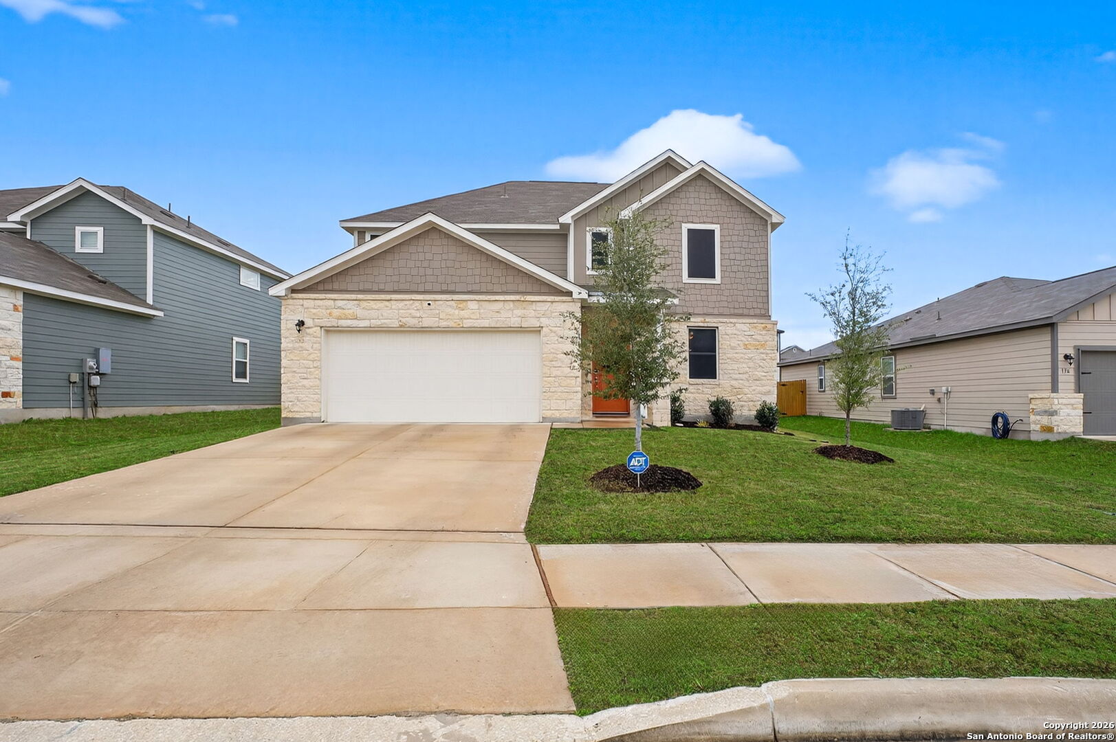 132 Bella Rosa Trail Cibolo, TX 78108 - Photo 2 of 49 a front view of a house with a yard and garage