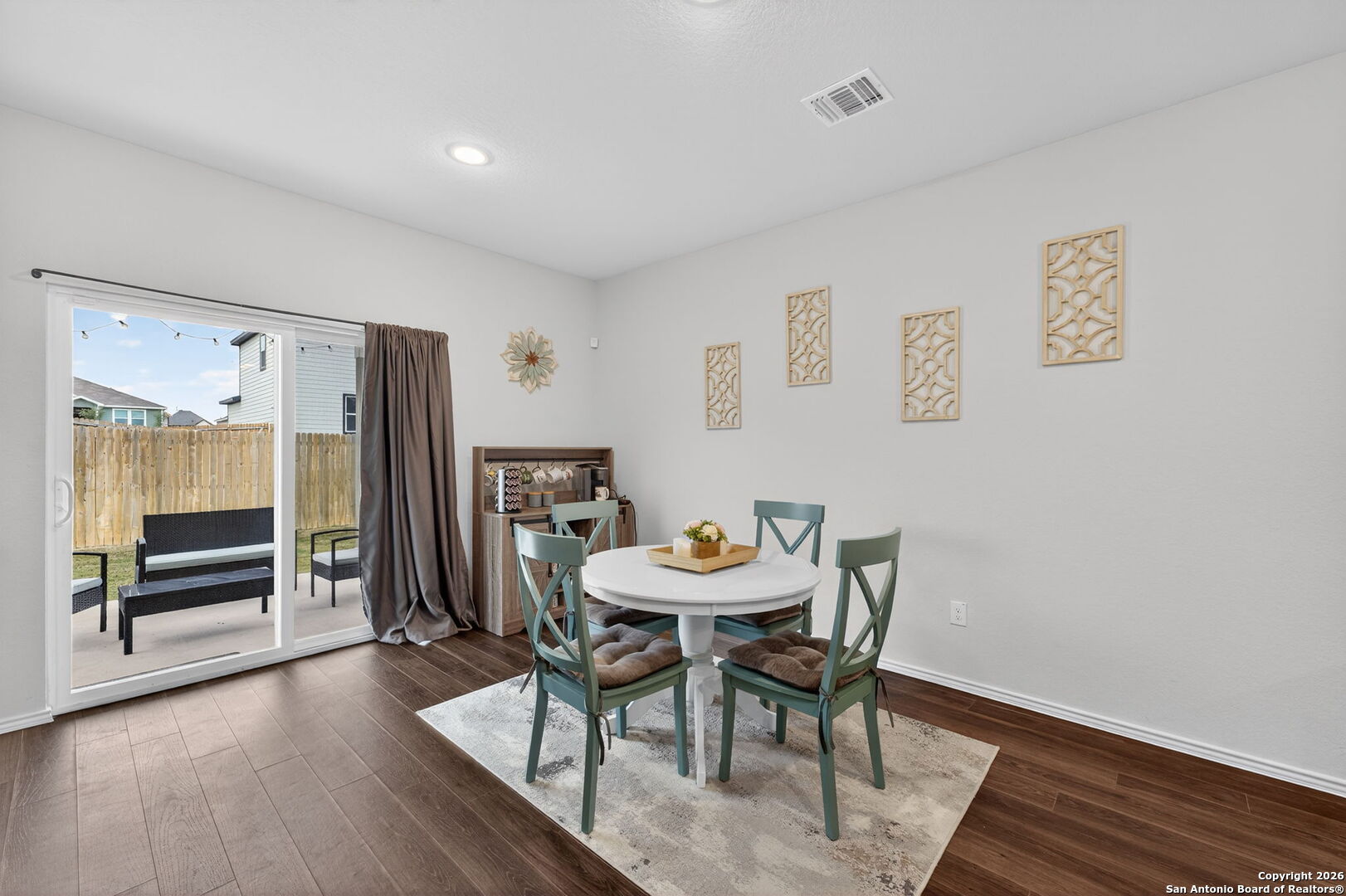 132 Bella Rosa Trail Cibolo, TX 78108 - Photo 25 of 49 a view of a dining room with furniture window and wooden floor