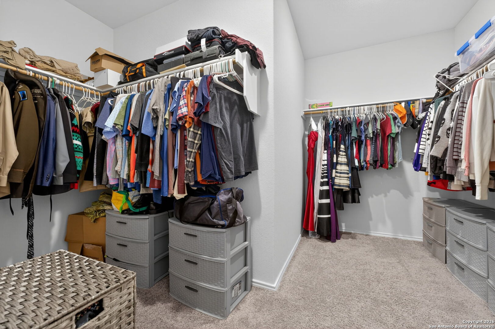132 Bella Rosa Trail Cibolo, TX 78108 - Photo 34 of 49 a view of walk in closet with clothes and shoes