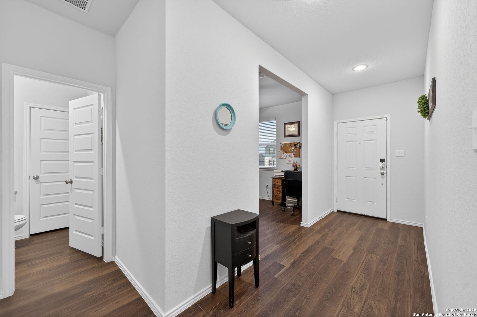 132 Bella Rosa Trail Cibolo, TX 78108 - Photo 5 of 49 a view of a hallway with wooden floor and closet