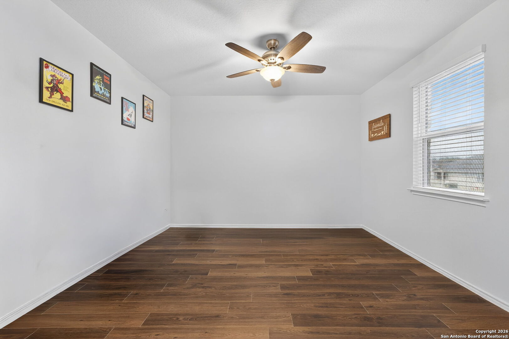 132 Bella Rosa Trail Cibolo, TX 78108 - Photo 7 of 49 a view of a room with wooden floor and window