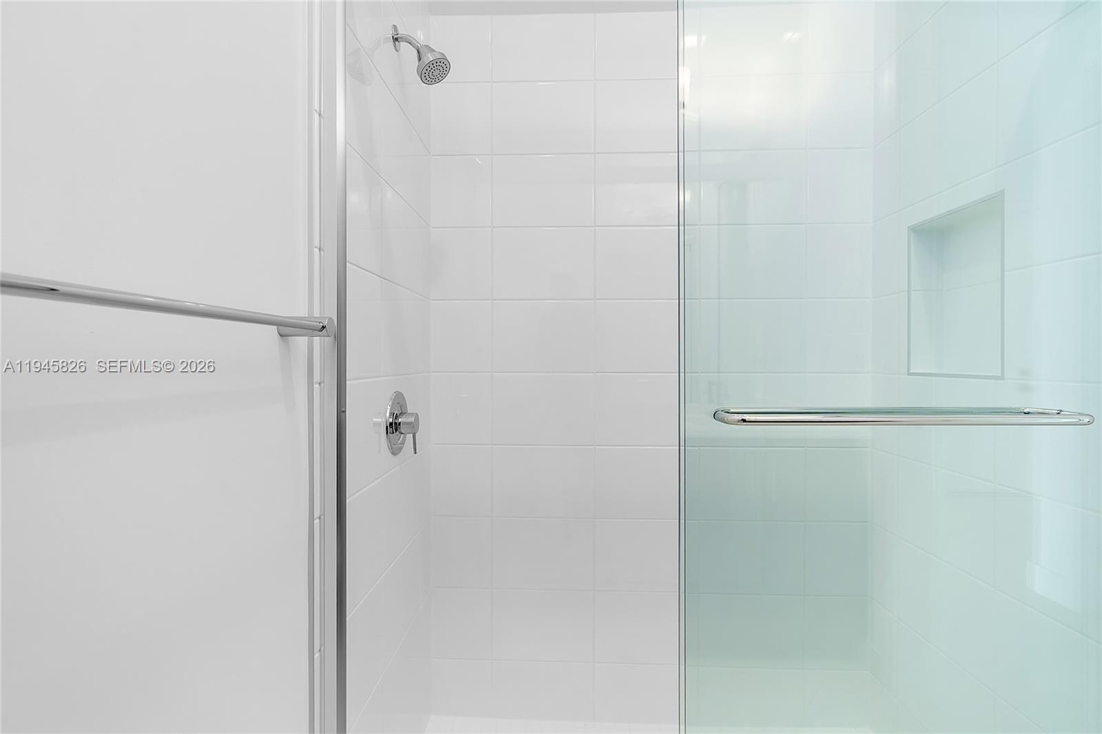 9362 Tulip Leaf Court Boca Raton, FL 33434 - Photo 18 of 80 a bathroom with a glass shower door