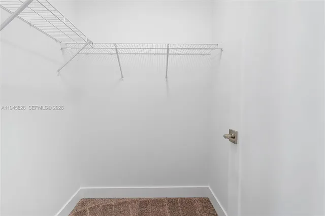 a bathroom with a bathtub sink and mirror