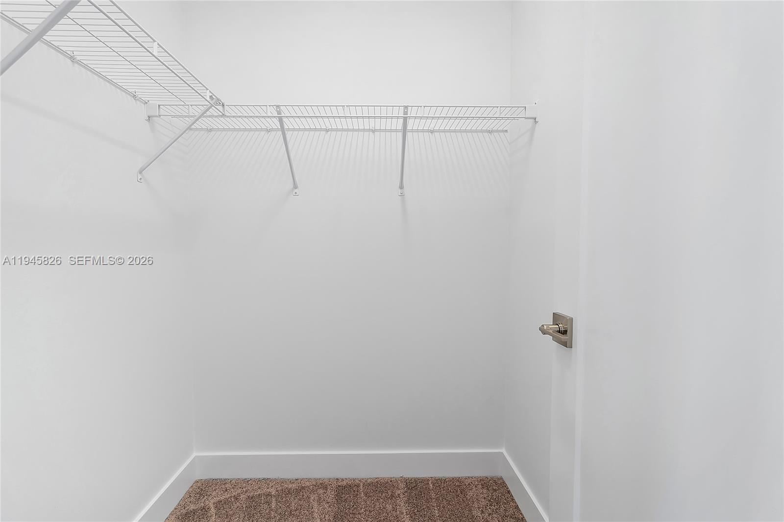 9362 Tulip Leaf Court Boca Raton, FL 33434 - Photo 32 of 80 a view of a room with racks on the wall