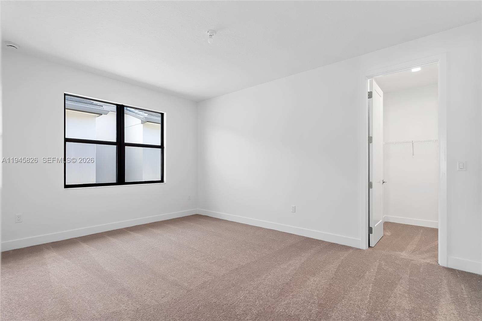 9362 Tulip Leaf Court Boca Raton, FL 33434 - Photo 37 of 80 an empty room with windows