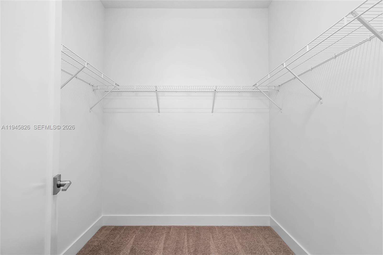 9362 Tulip Leaf Court Boca Raton, FL 33434 - Photo 48 of 80 a view of a room with racks on the wall