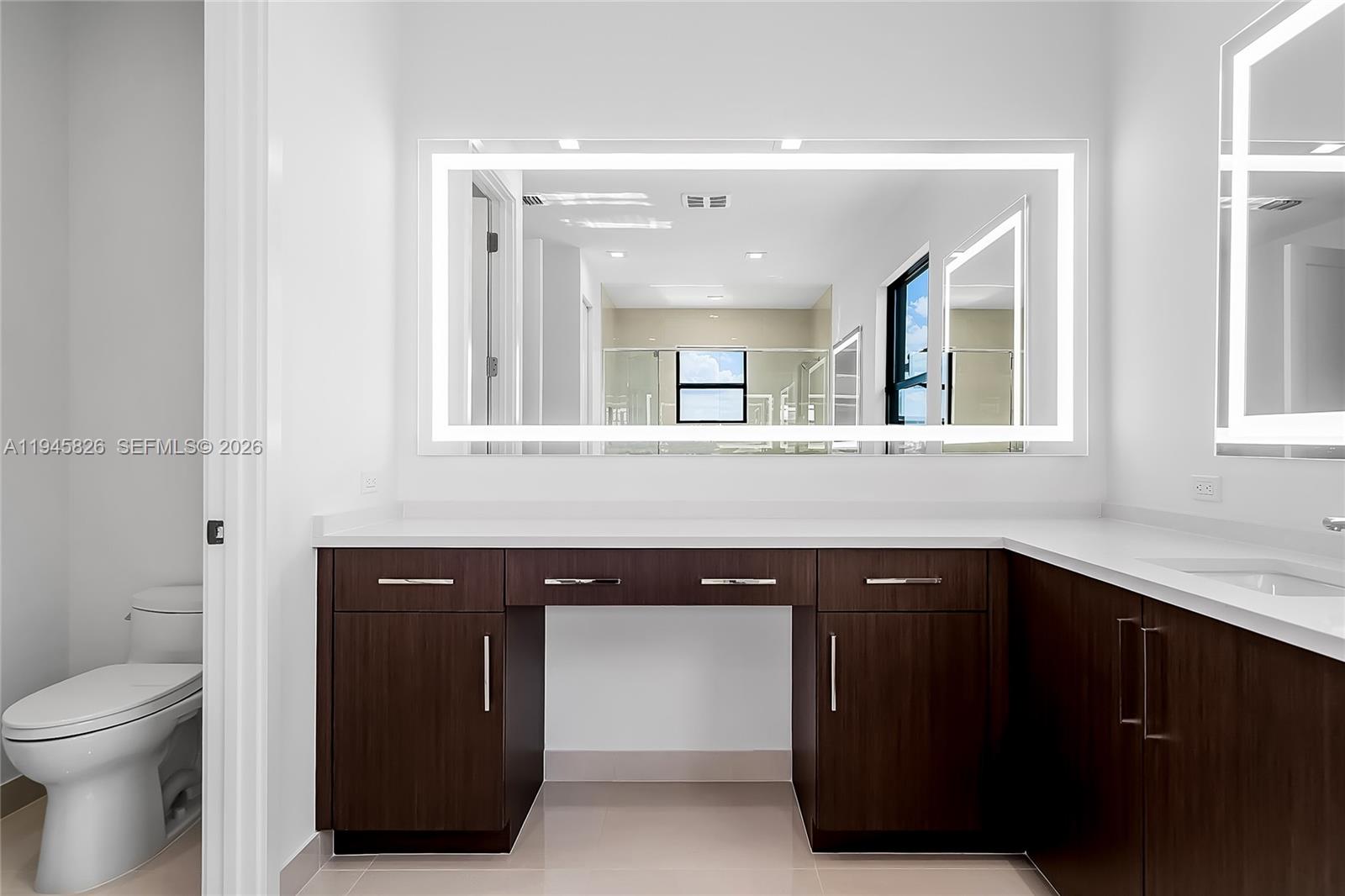 9362 Tulip Leaf Court Boca Raton, FL 33434 - Photo 54 of 80 a kitchen with a sink and a toilet