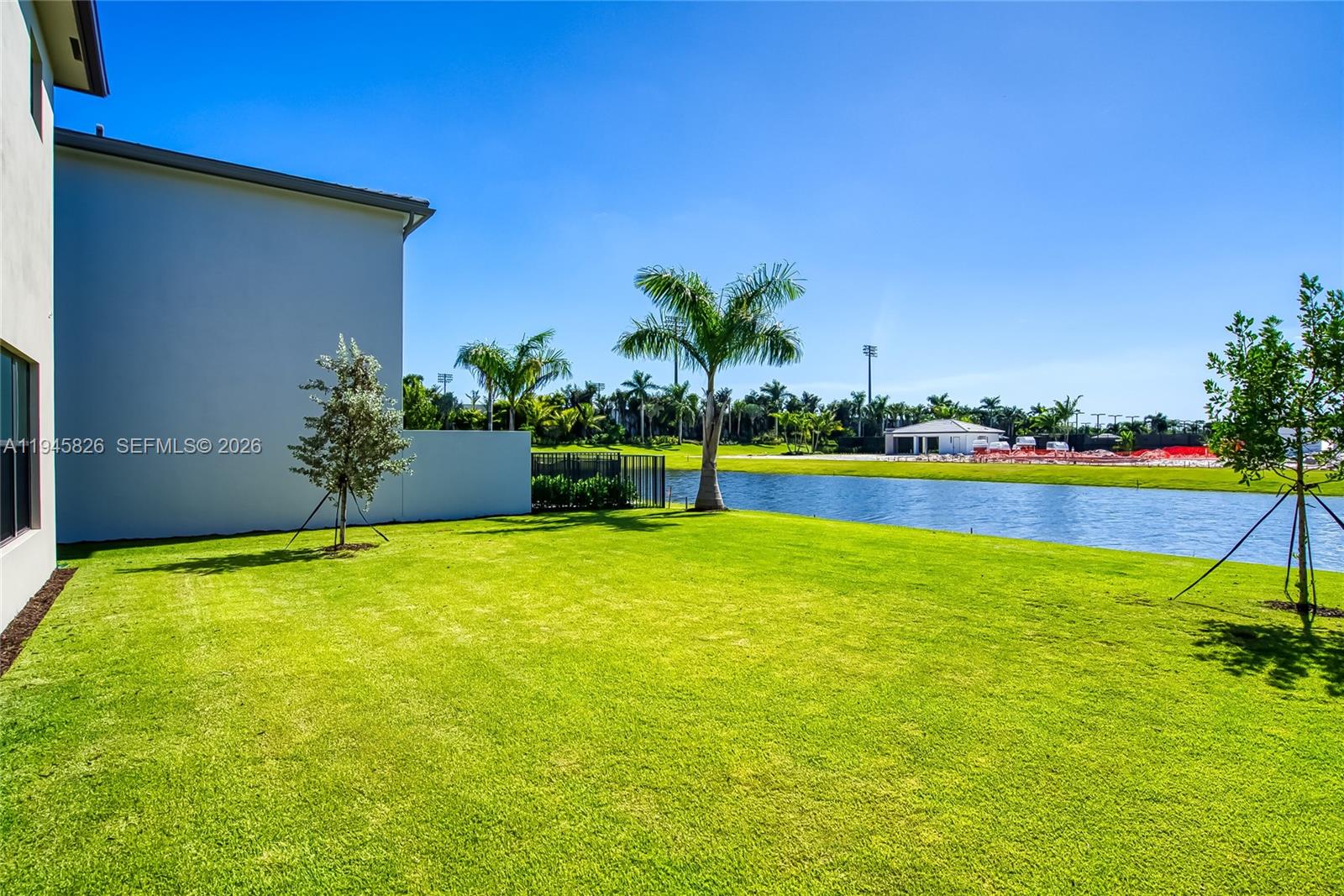 9362 Tulip Leaf Court Boca Raton, FL 33434 - Photo 66 of 80 a view of a swimming pool with an outdoor space and seating area
