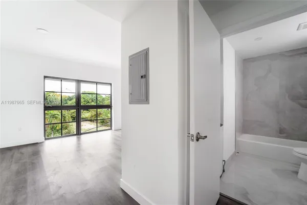 a view of an empty room with a window