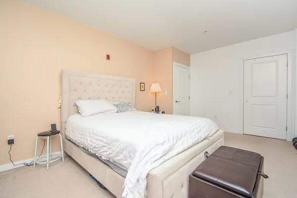 a bedroom with a bed and a cabinets