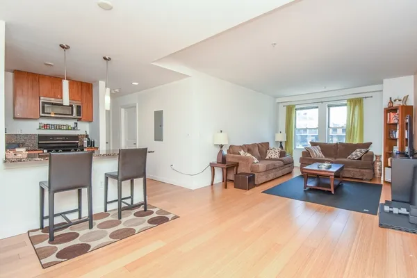 a living room with furniture and a table