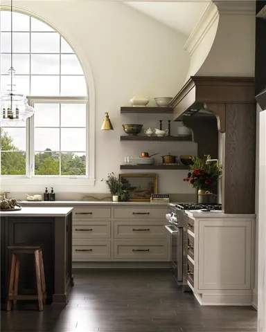 a kitchen with a sink a stove and cabinets