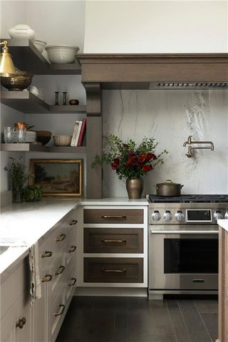 a kitchen with a stove and cabinets