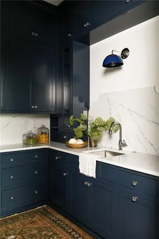 a kitchen with a sink and cabinets