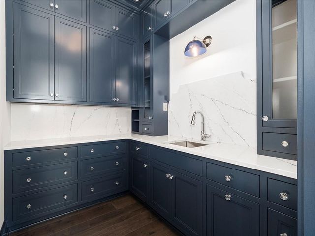 a kitchen with a sink and cabinets