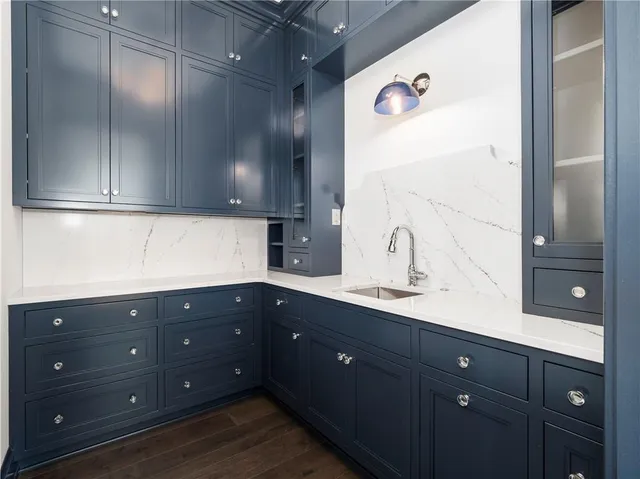 a kitchen with a sink and cabinets