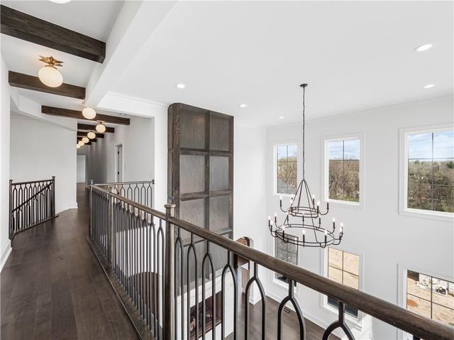 a view of an entryway with wooden floor