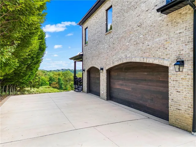 a front view of a house with a garage
